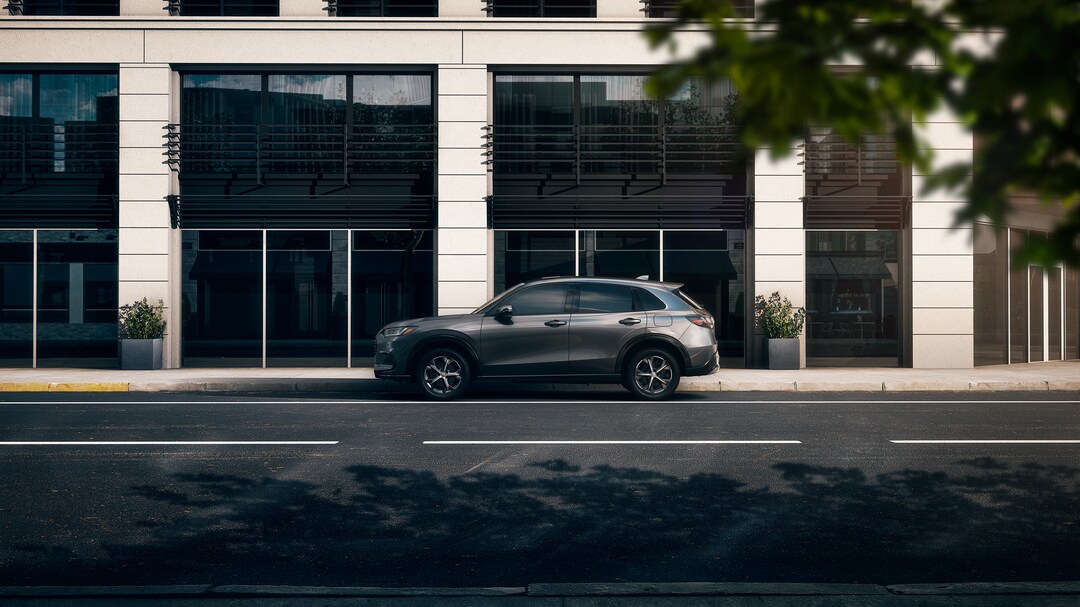 Honda inv black Honda HR-V driving on a trail road