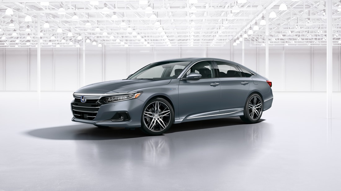 2022-Honda-AccordHybrid-Touring-Sedan-L06.png silver Honda Accord hybrid in a white room