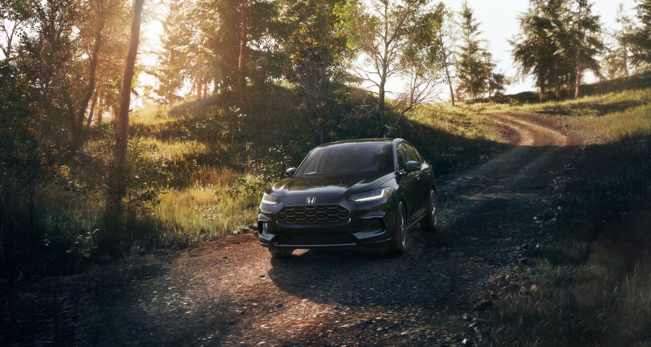 black Honda HR-V driving on a trail road
