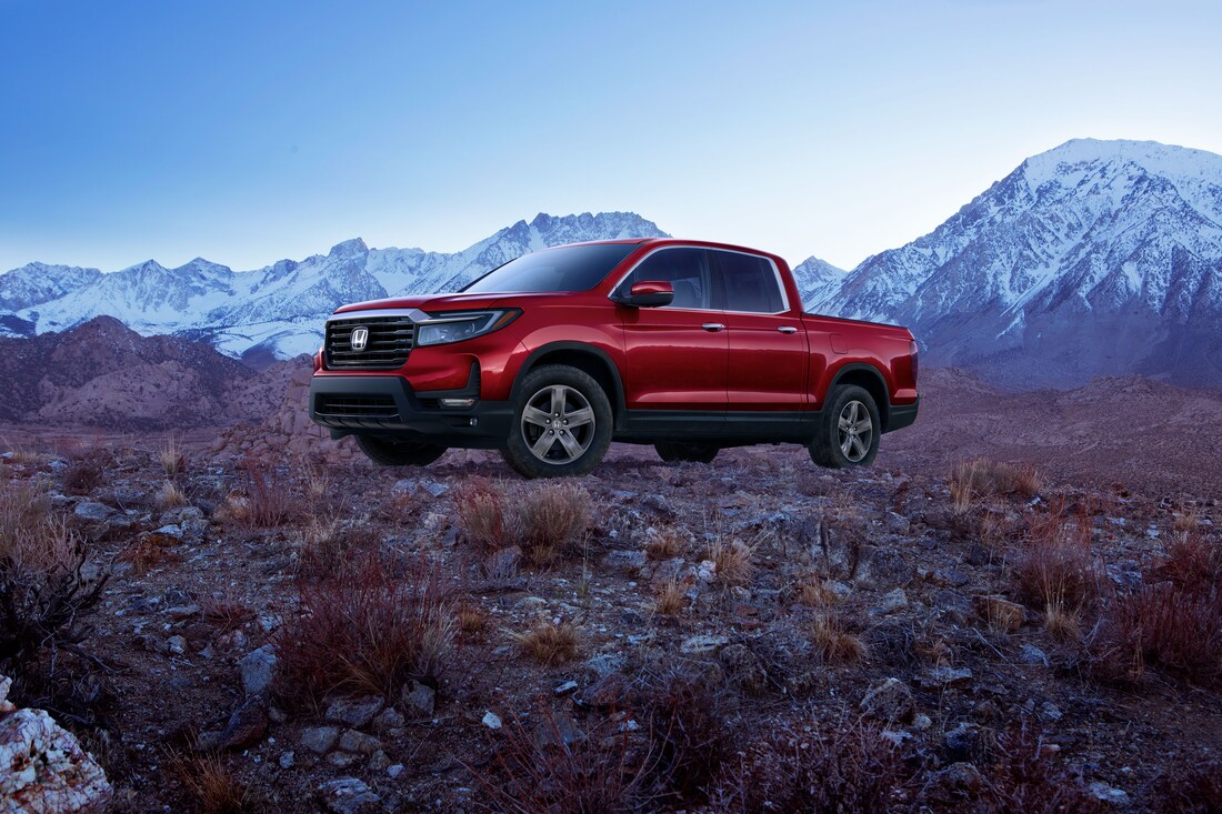 2023-Honda-Ridgeline-RTL-E-CrewCab-Truck-L04.png red Honda Ridgeline truck parked in sagebrush