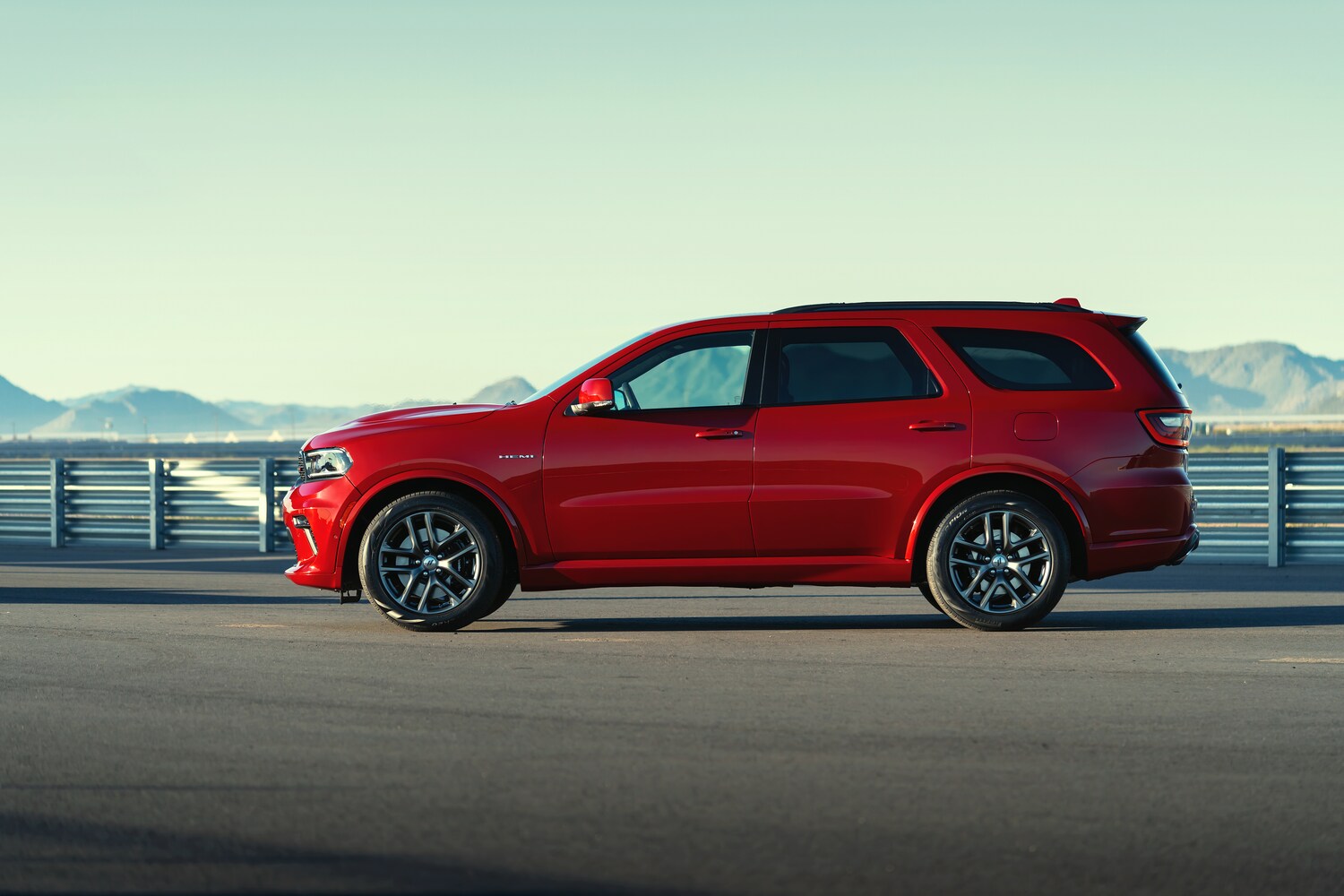 2021-Dodge-Durango-RT-SUV-L04.png red Dodge Durango SUV parked in front of a blue sky