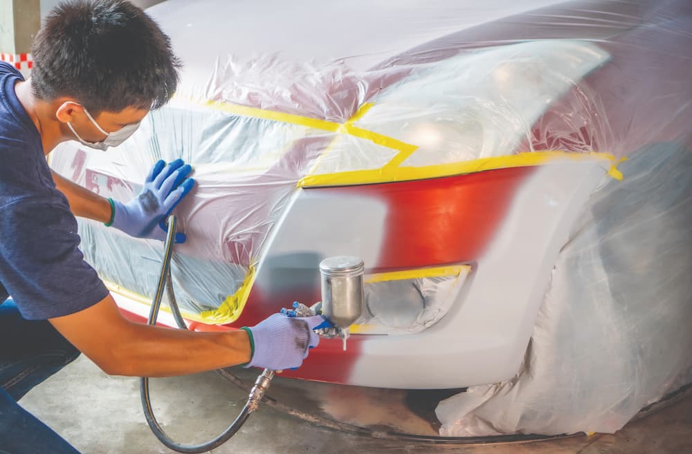RepairingCarBody-1179595806.jpg