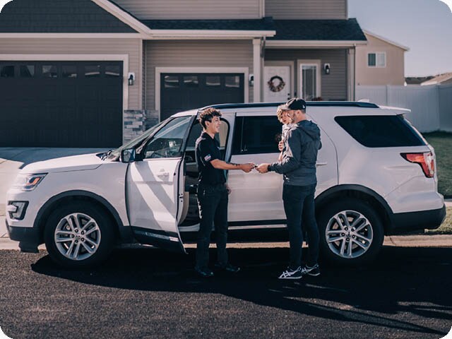 Pickup and Delivery services available in Roseburg, OR. Service representative returning serviced vehicle.