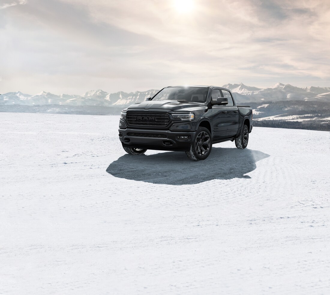 2023-RAM-1500-Limited-CrewCab-BlackEdition-Truck-L04.png black Ram 1500 truck parked on a snowy tundra