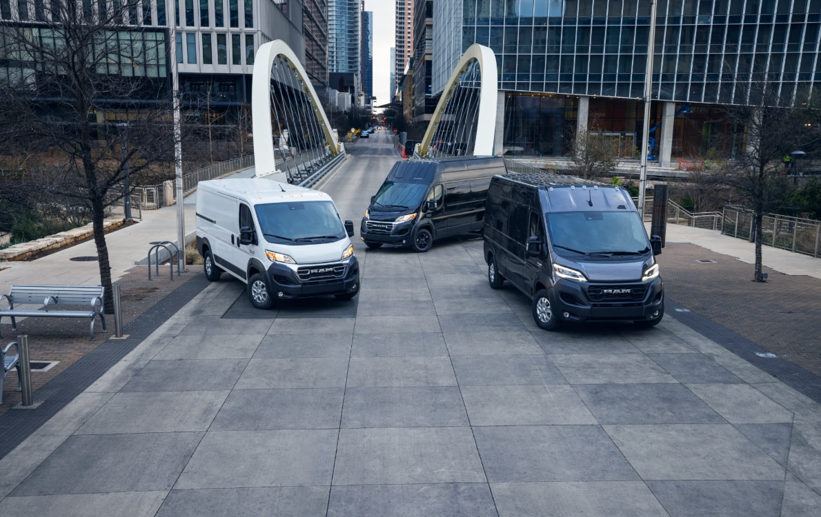 2023 Ram ProMaster 1500 EV.PNG Ram ProMaster EV lineup parked in front of office buildings