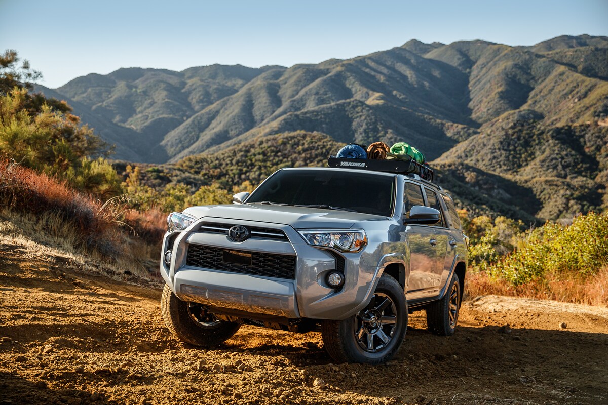 2022-Toyota-4Runner-TrailSpecialEdition-SUV-L01.png silver Toyota 4Runner SUV parked on a trail