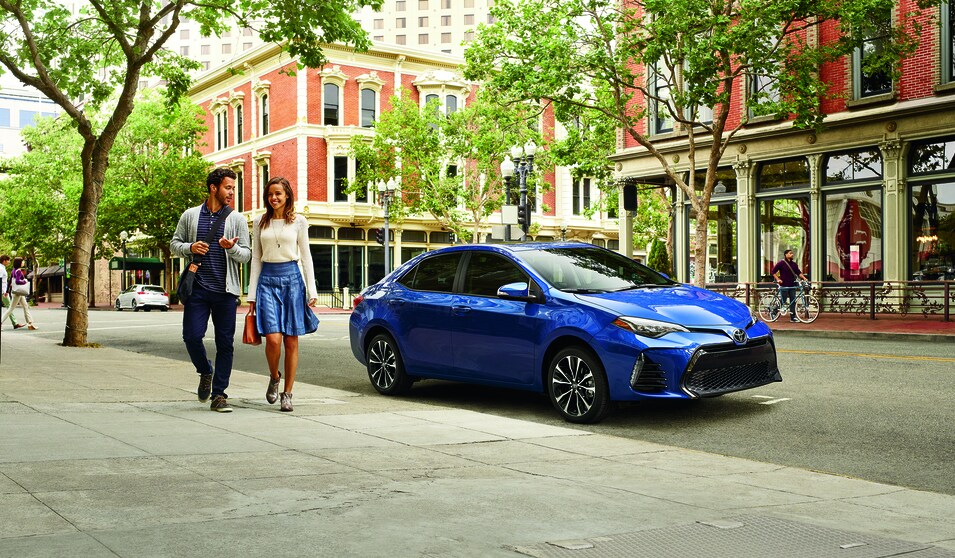 2016 Camry Blue (2).png blue Toyota Camry sedan parked on a city street