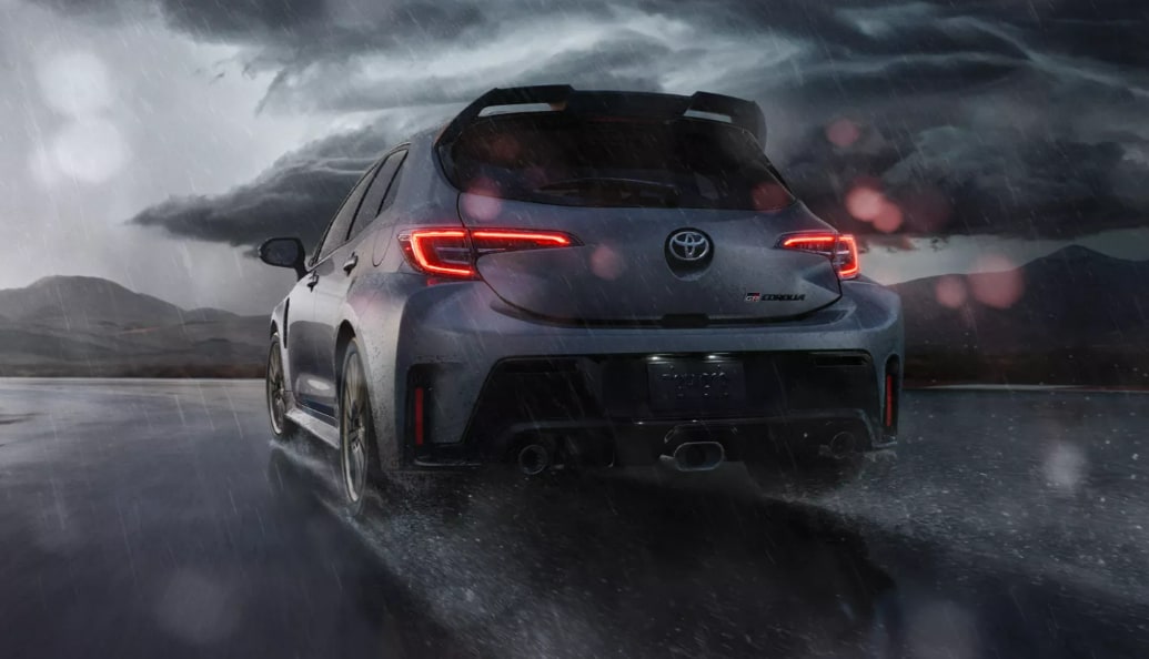 2023 Toyota GR Corolla Rear.PNG Toyota GR Corolla rear shot, driving on a track in the rain