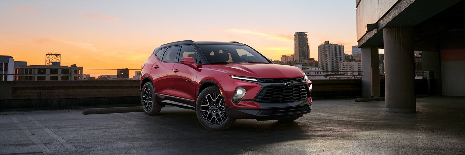 2025 Chevy Blazer Black Chevy Blazer parked in front of a
lighthouse overlooking rocky coast