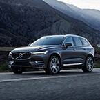2018 Volvo XC60 driving by mountains