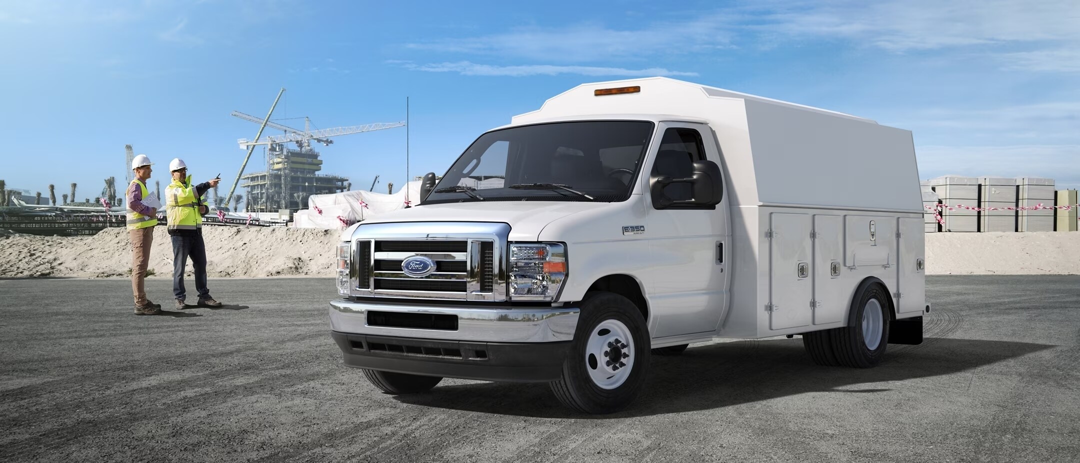 2024 Ford E-Series Cutaway with aftermarket shuttle bus body being driven through underpass