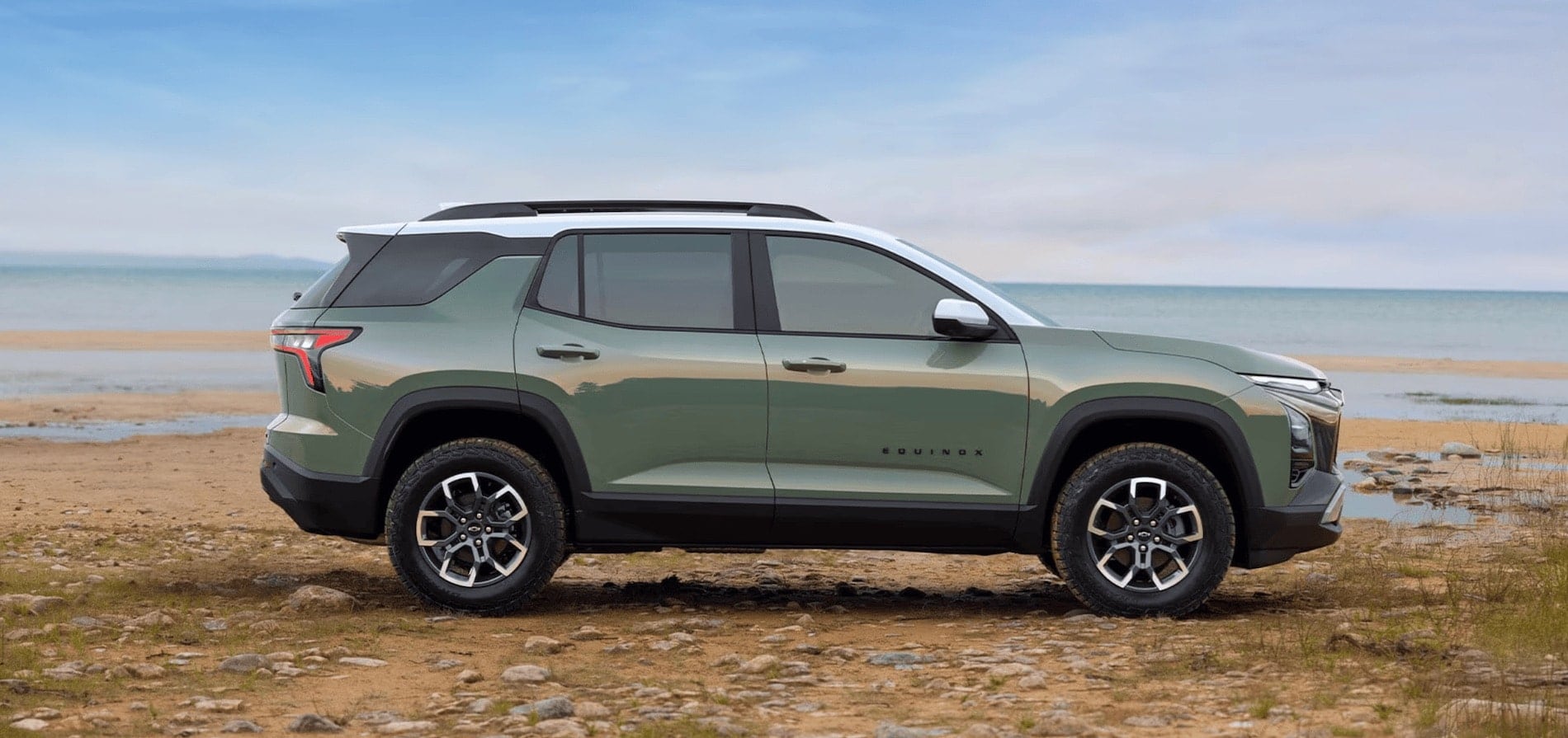2026 Chevrolet Equinox front three-quarter view on a tree-lined road