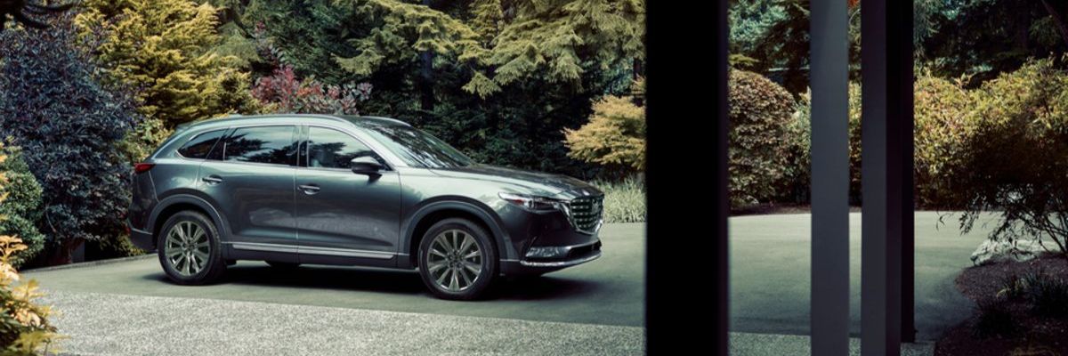2021 Mazda CX9 Signature SUV parked in foliage filled driveway_res2.jpeg