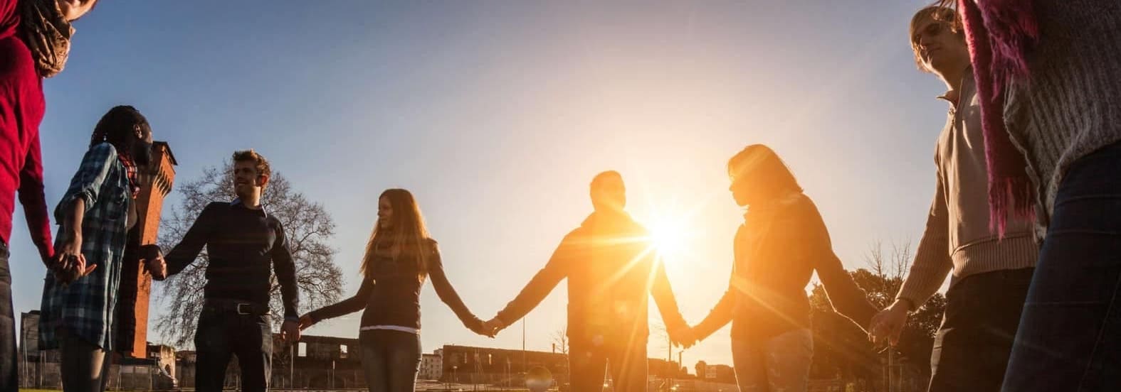 Multiracial-Young-People-Holding-Hands-in-a-Circle_38805871.jpg