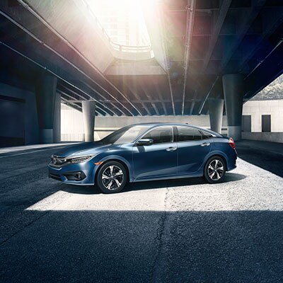 16_Civic_Sedan_Touring_Location_Sunlight_CosmicBlueMetallic.jpg