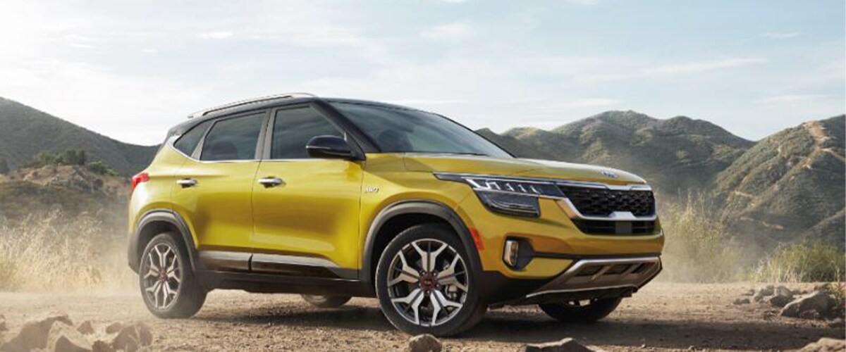 Yellow Kia Seltos parked