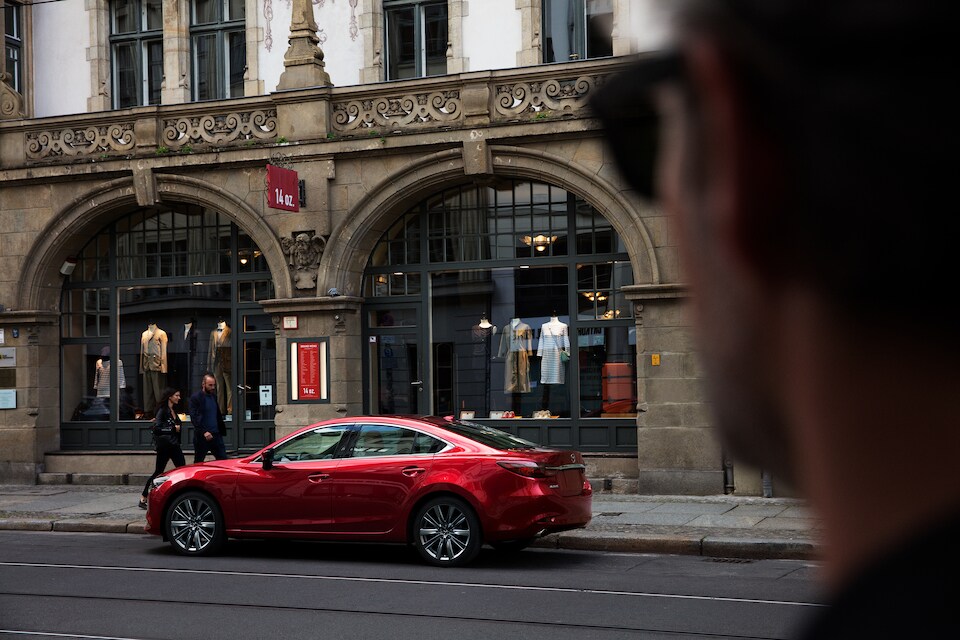 2018 Mazda Mazda6 Signature Sedan man looking at car.jpeg