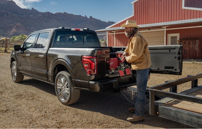 Cowboy loading his truck with tools