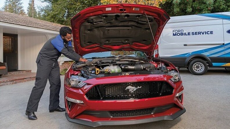 Maguire's Ford of Duncannon Technician working on engine bay