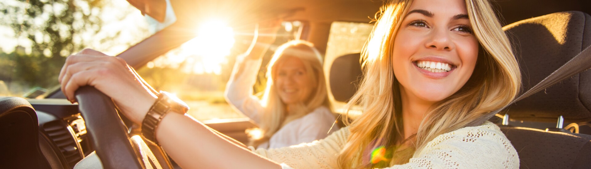 Mom and daughter in her first car