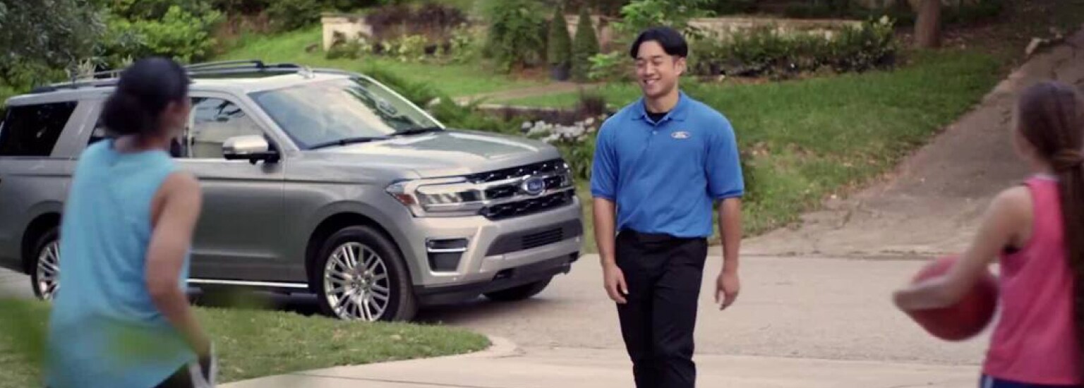 Maguire's Ford of Duncannon Technician picking up vehicle at a home