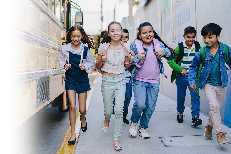 Kids walking to school from their school bus