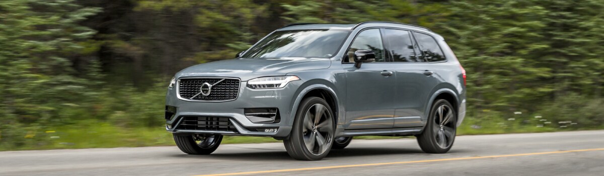 2020-Volvo-XC90-RDesign-T5-SUV-L01 (1).jpg Volvo XC90 driving through the green hills