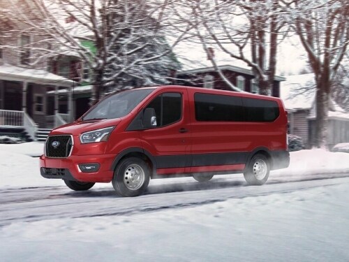 2025 Ford Transit Van driving in the snow