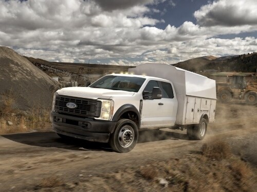 2025 Ford Super Duty Chassis Cab driving on a dirt path