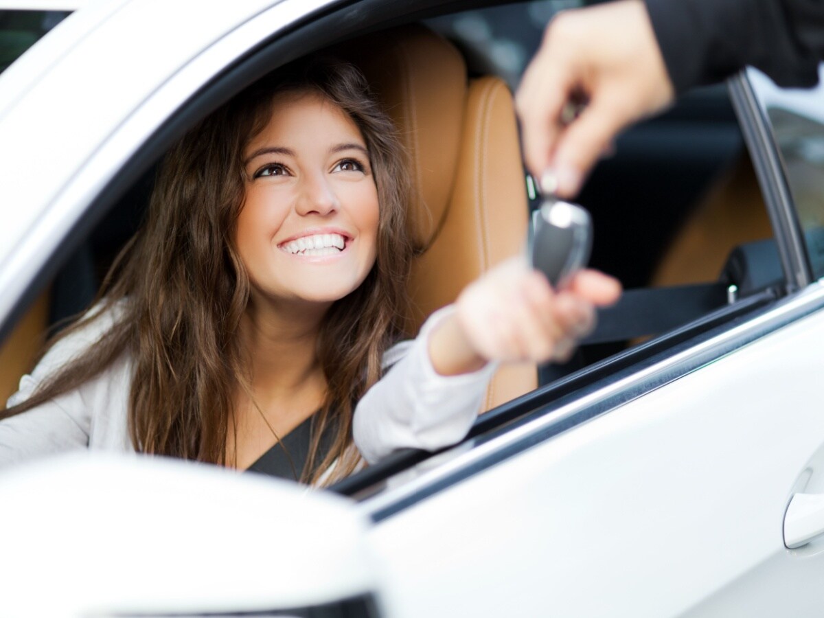 Customer receiving vehicle keys after a purchase