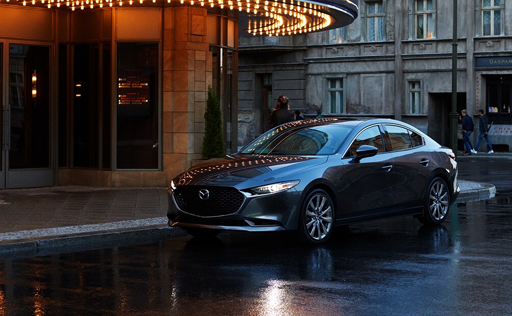 Who makes the best synthetic oil at Mazda of New Bern in New Bern | 2020 Mazda6 parked outside theater in rain
