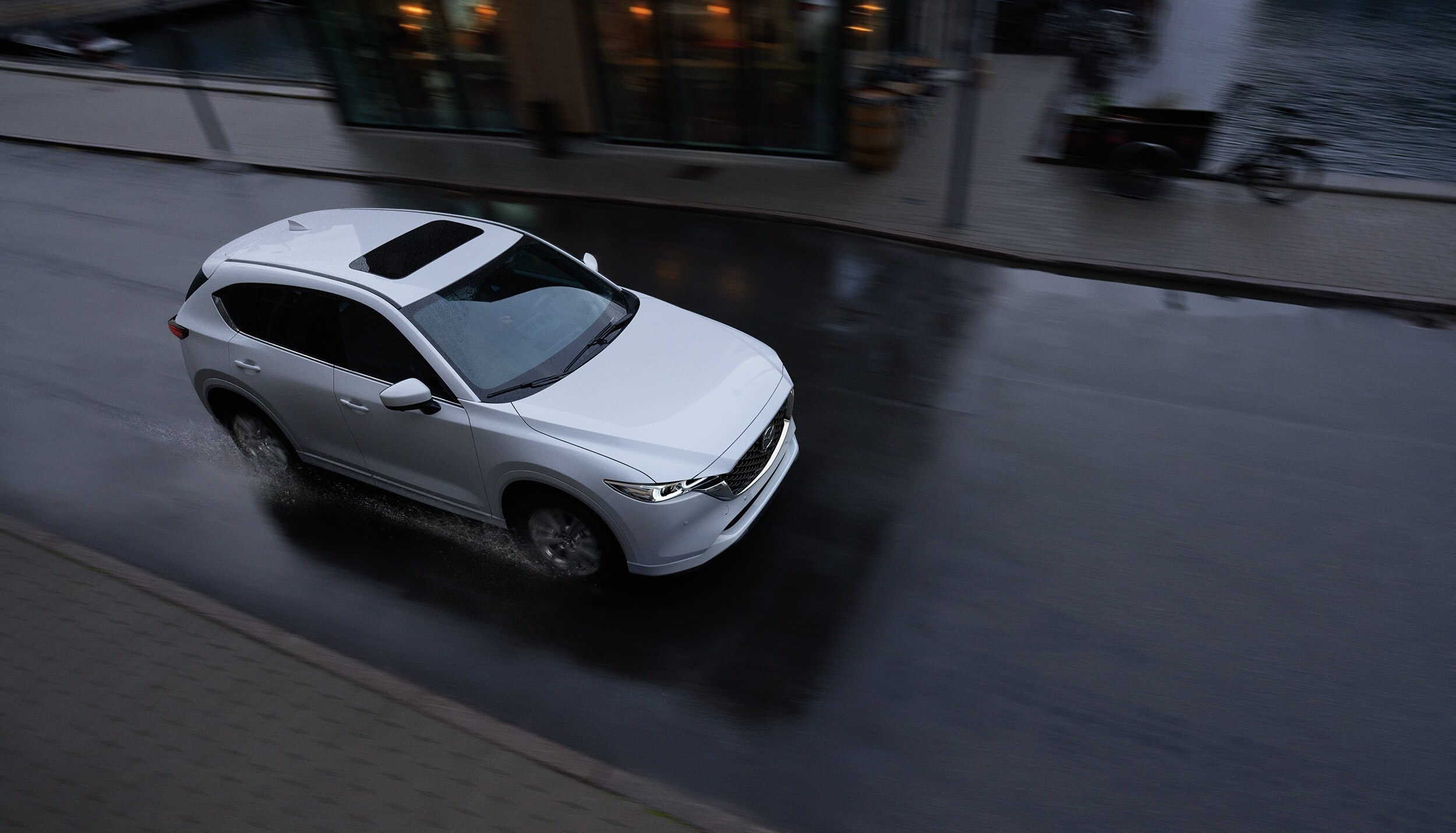 2023-Mazda-CX-5-Top-Driving.jpg