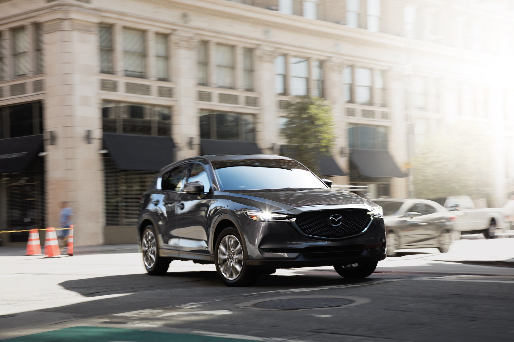 Mazda of New Bern is a Car Dealership in New Bern near Grantsboro, NC | 2020 Mazda CX-5 driving through city