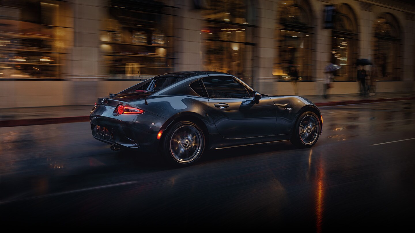 2023-mazda-mx-5-miata-rf-driving-black.jpeg
