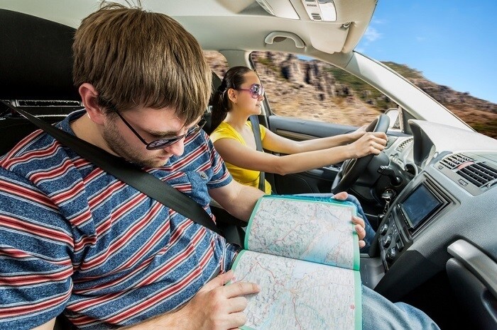 Couple_Driving_And_Looking_At_Map.jpg