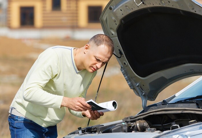 Man_Trying_To_Fix_Car.jpg