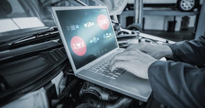 Mazda Service Center Checking Car With laptop