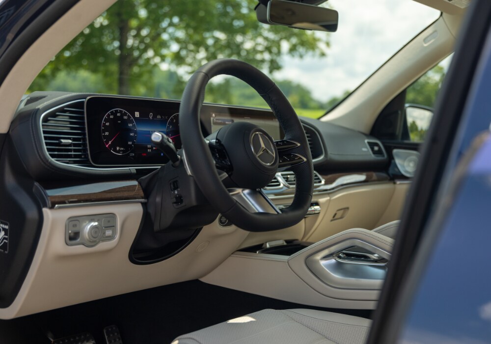 2025-mercedes-benz-gls-450-interior.png Mercedes-Benz GLS 450 interior, including the steering wheel. The interior of the car is a beige leather