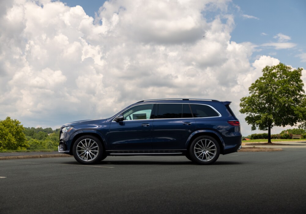 mb-gls-450-sub-for-sale.png Driver's side exterior view of the Merceds-Benz GLS 450 parked on a paved lot with a cloudy sky in the background