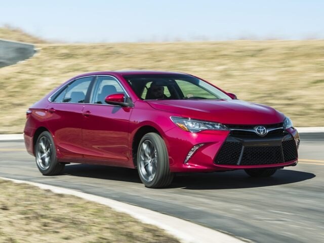 2017 Toyota Camry sedan red driving on road.jpg