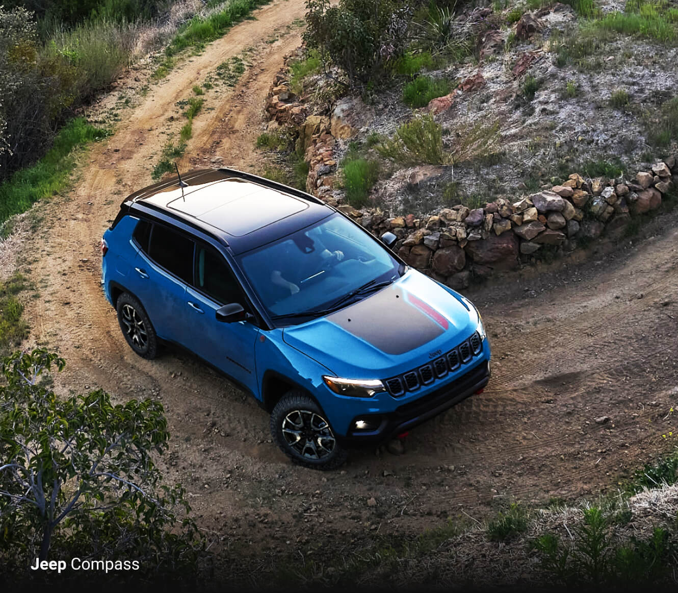 2025 Jeep Compass Trailhawk in two-tone Hydro Blue and Black
