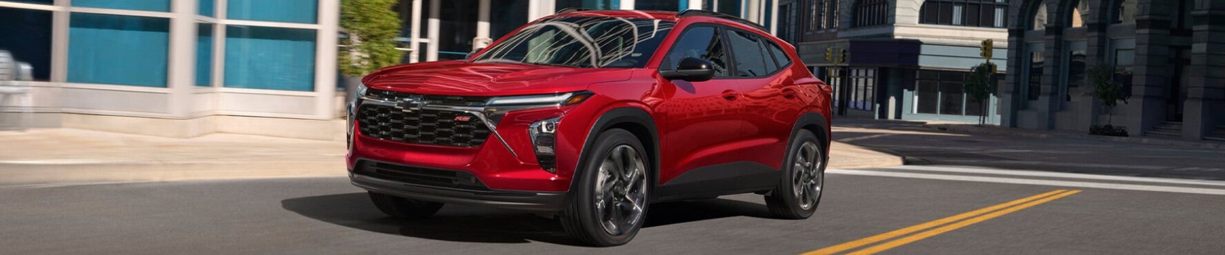 2026 Chevy Trax in red on a city street