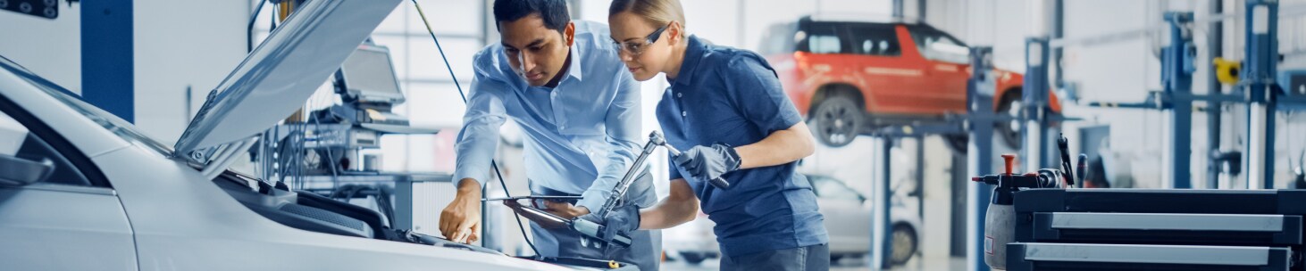 Certified Chevrolet service technicians completing an inspection