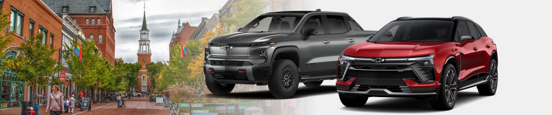 Gray Silverado EV and red Blazer EV parked in front of Church Street Marketplace