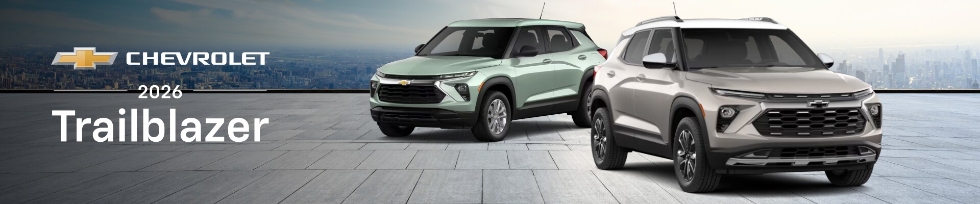2026 Chevy Trailblazer ACTIVE in White Sands parked in front of a 2026 Trailblazer LS in Cacti Green