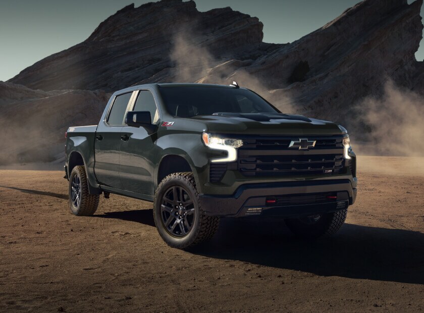 Chevy Silverado 1500 Off-Roading, kicking up dirt in its path
