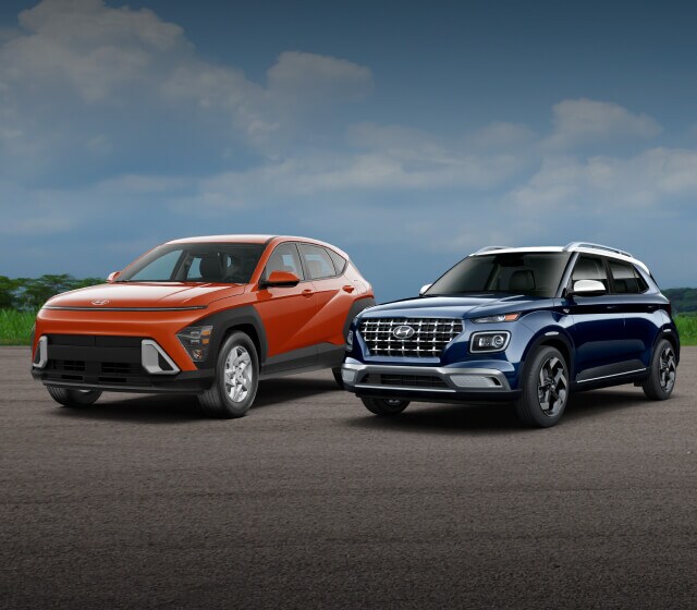 2025 Hyundai Kona ICE SE AWD in Soultronic Orange & a 2025 Hyundai Venue Limited in Denim with a White Roof