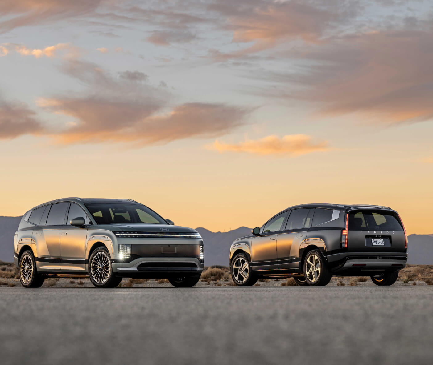 Two Hyundai SUVs parked during a sunset