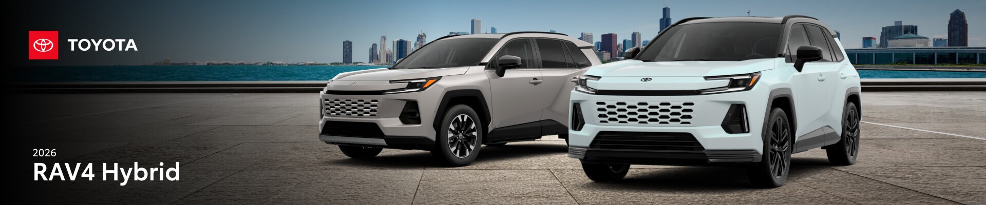 Two 2026 Toyota RAV4 models parked in front of a city backdrop