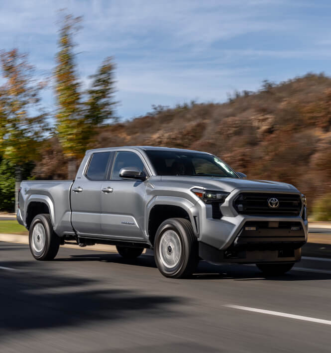 2025 Toyota Tacoma SR5 driving on an open road